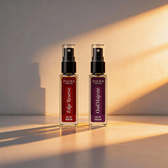 Two Zoura Perfume bottles, 'Edge Reserve' and 'Oud Majesty', on a light background with soft shadows.