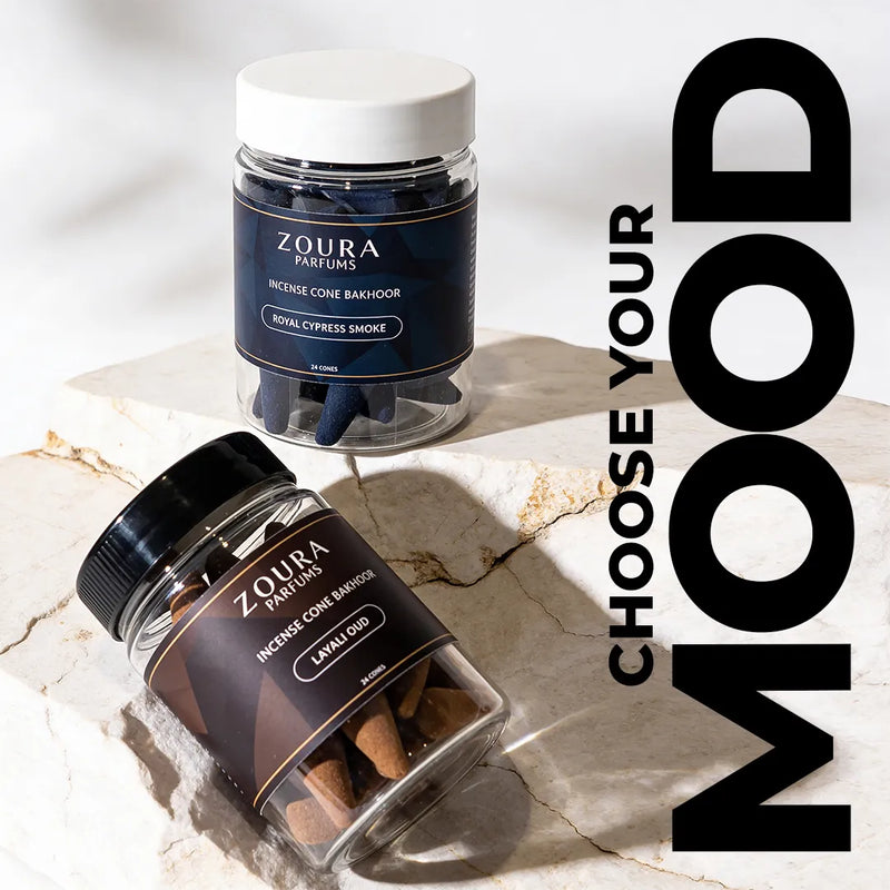 Two jars of Zoura Parfums incense cones on a marble surface with 'Choose Your Mood' text.