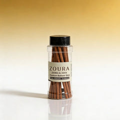 Jar of Zoura premium bakhoor sticks on a gradient background