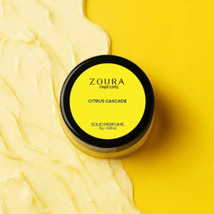 Zoura Citrus Cascade Solid Perfume on yellow background