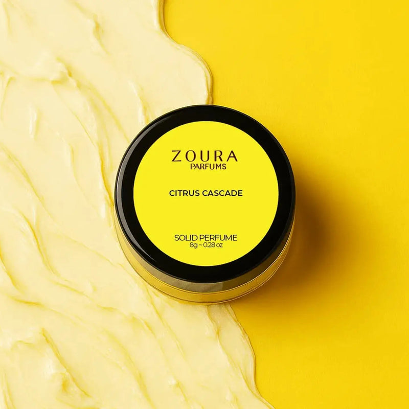 Zoura Citrus Cascade Solid Perfume on yellow background