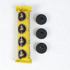 Yellow charcoal package with black circular items on a white background