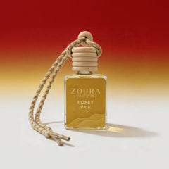 Zoura Parfums Honey Vice perfume bottle with rope on a gradient background