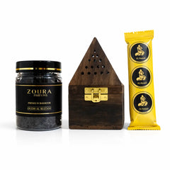 Zoura Parfums oudh al sultani, wooden incense burner, and charcoal rings with branding on a white background