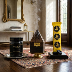 Zoura bakhoor chips on a wooden floor with burner and rings