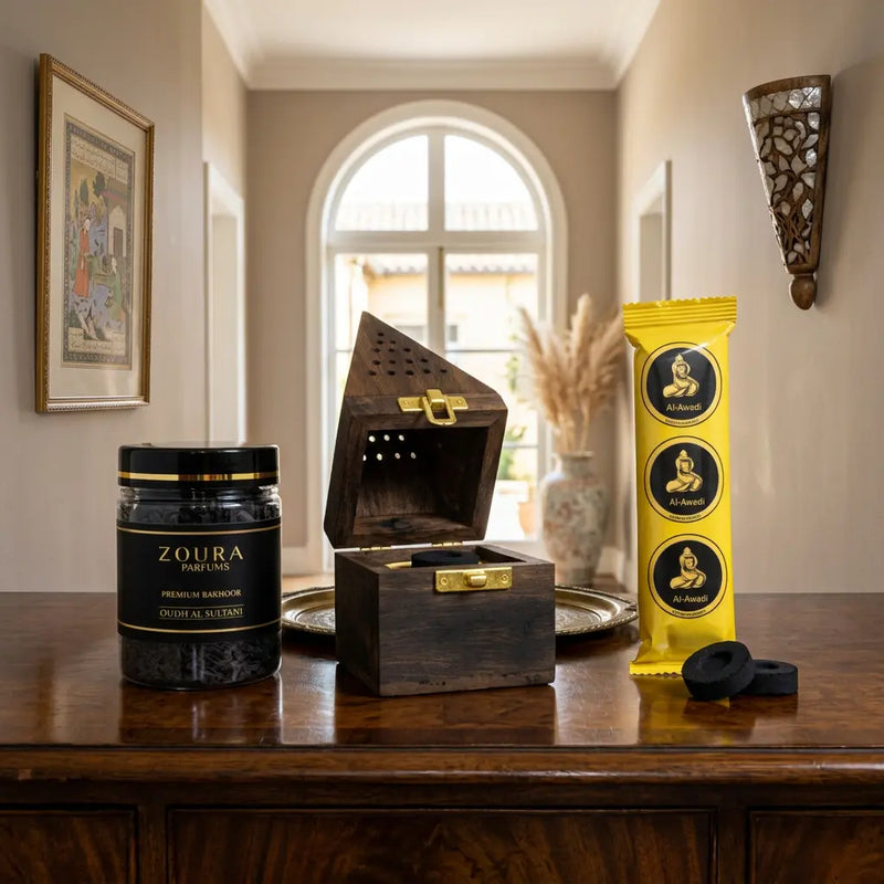 Zoura bakhoor chips oudh al sultani with burner on a wooden table with a decorative box and packaging.