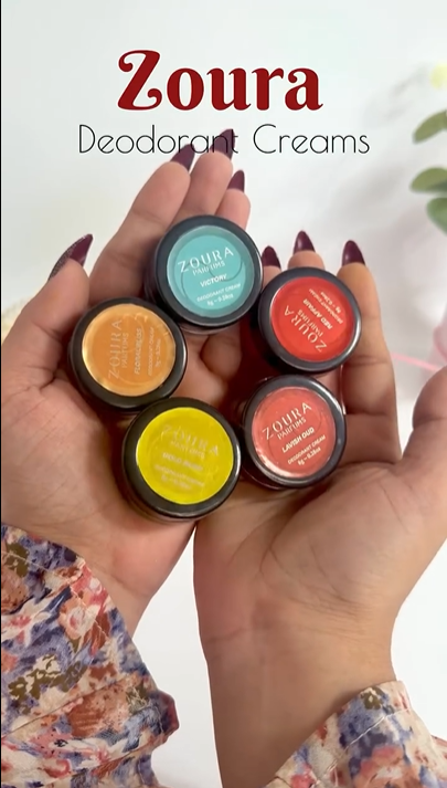 Hand holding five Zoura Parfums 8g solid perfume jars in an array of colors, product showcase video.