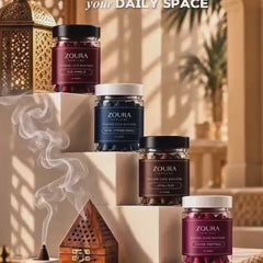 Zoura Parfums bakhoor incense cones displayed on elegant steps with aromatic smoke in a warm luxury setting.