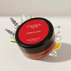 Zoura Amber Bloom Unisex Solid Perfume jar with lavender, crystals, and orange slice