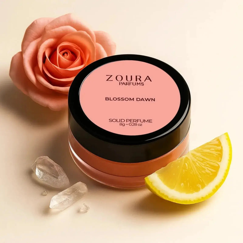 Zoura Blossom Dawn Luxury Solid Perfume jar with pink rose, lemon slice, and crystals