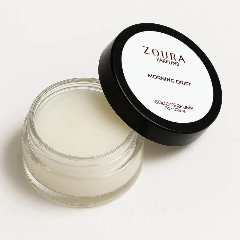Open jar of Zoura Morning Drift Unisex Solid Perfume showing cream texture, 8g