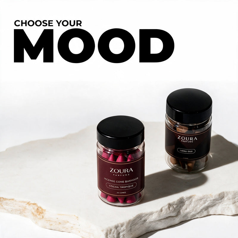 Choose your mood: Zoura Oud Al Layl bakhoor incense cones duo, Cocoa Tropique and Lavali Oud jars on a white stone slab