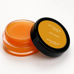 Open jar of Zoura Oud Cream Luxury Unisex Solid Perfume showing amber balm texture, 8g