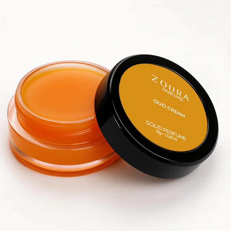 Open jar of Zoura Oud Cream Luxury Unisex Solid Perfume showing amber balm texture, 8g