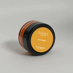 Side view of Zoura Oud Cream Luxury Unisex Solid Perfume jar on grey background