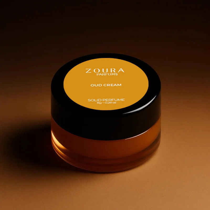Zoura Oud Cream Luxury Unisex Solid Perfume jar with warm amber tone background