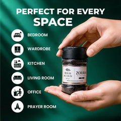 Hand holding Zoura Parfums Rouh Al Oud bakhoor, perfect for every room in the home