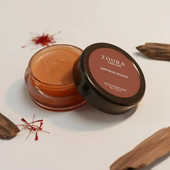 Open jar of Zoura Saffron Woods Luxury Fragrance Solid Perfume with saffron strands and wood